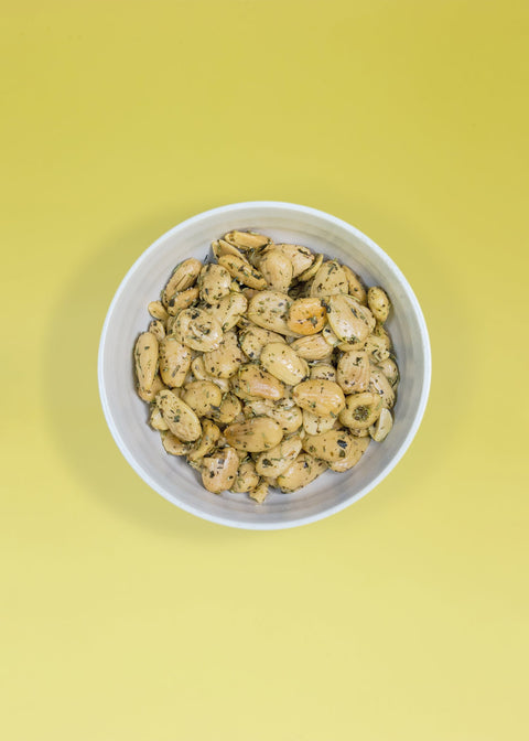 Bowl of almonds fried with herbs for a snack