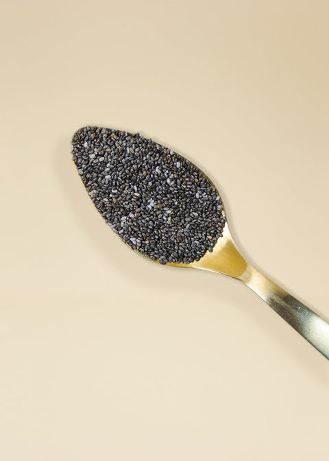 superior quality chia seeds in a spoon, rich in omega-3, fiber and protein to improve your health